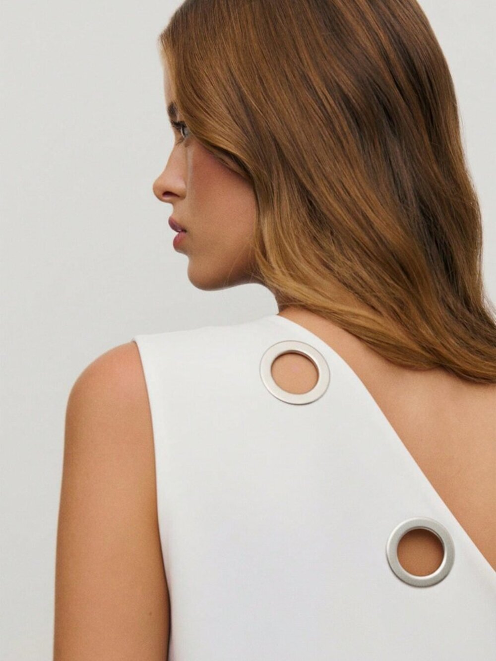 White Casual Women's One-Shoulder Asymmetrical Metal Eyelet Top - Picture 7 of 11